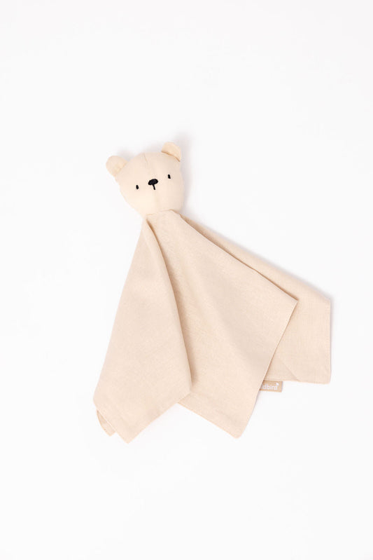 Beige bear-shaped blanket on a white background