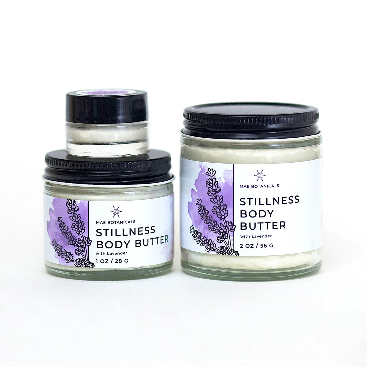 Stack of stillness body butter jars in all sizes