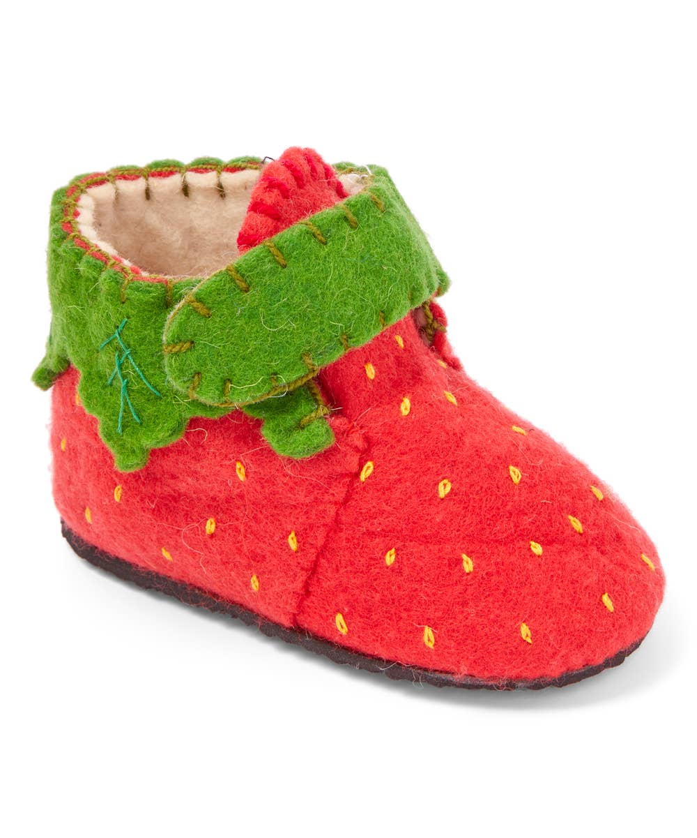 Red baby bootie with green trim on a white background