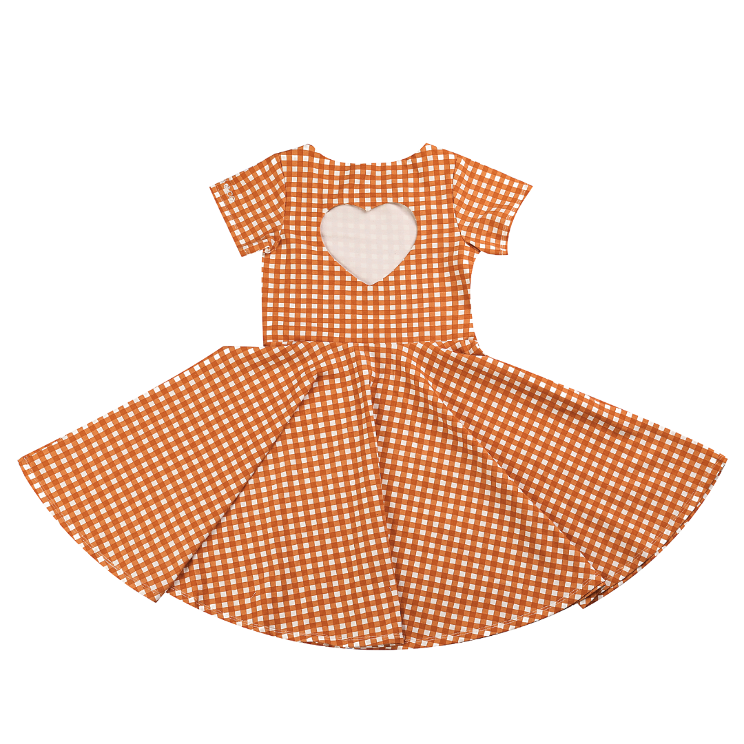 Orange checkered dress with a heart design on a white background