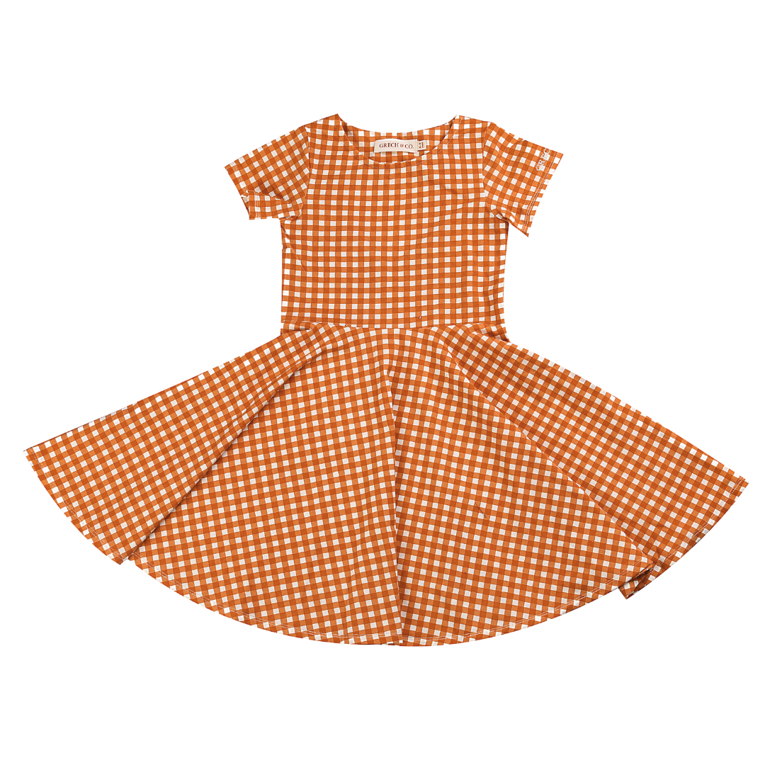 Orange and white checkered dress on a white background