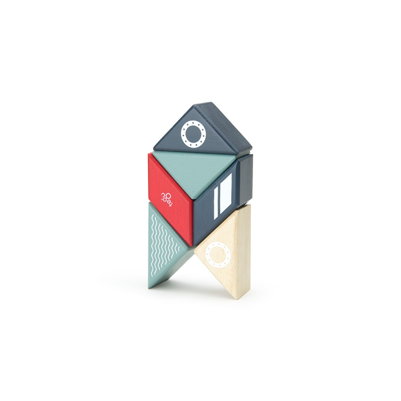 Colorful geometric house-shaped toy on a white background