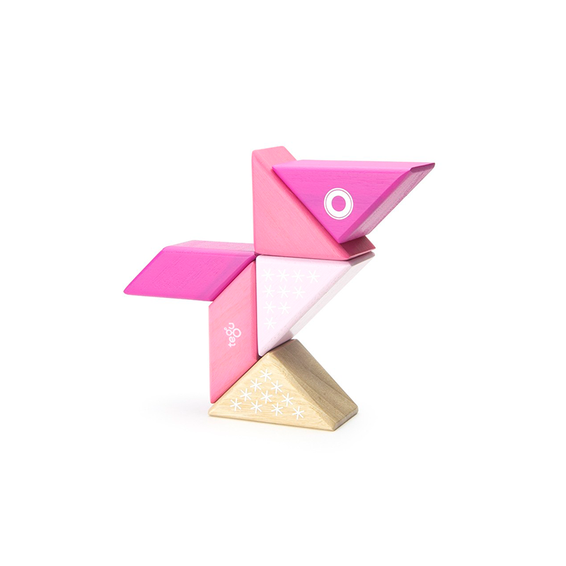 Pink and gold geometric puzzle toy on a white background
