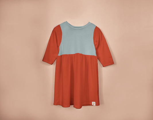 Two-tone dress with red and blue on a beige background