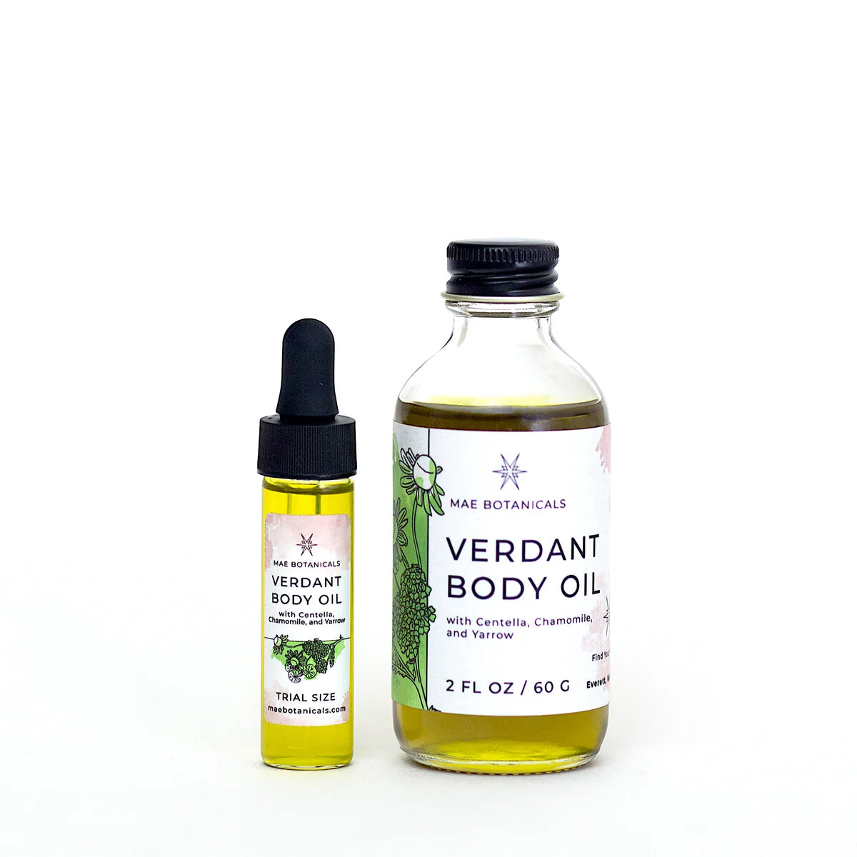 A trial size bottle of verdant body oil next to a 2 fl oz bottle