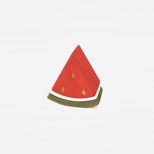 a wooden triangle piece of watermelon on a white back ground