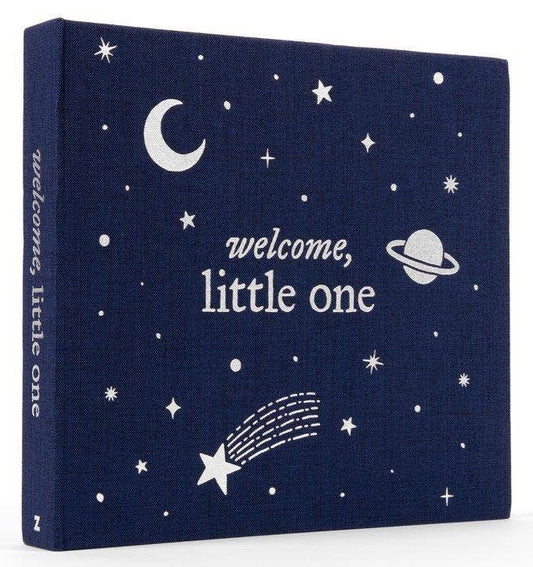 Navy blue album with white celestial designs and 'welcome, little one' text on a white background