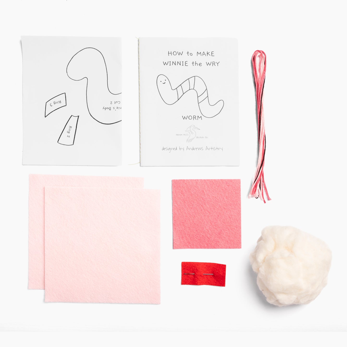 Materials for creating a craft project with templates, yarn, and other supplies on a white background