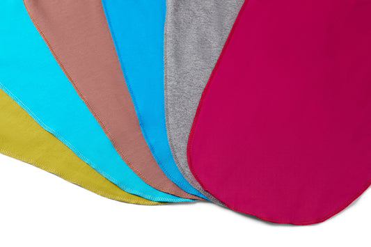 Set of colorful fabric swatches arranged in a circular pattern on a white background.