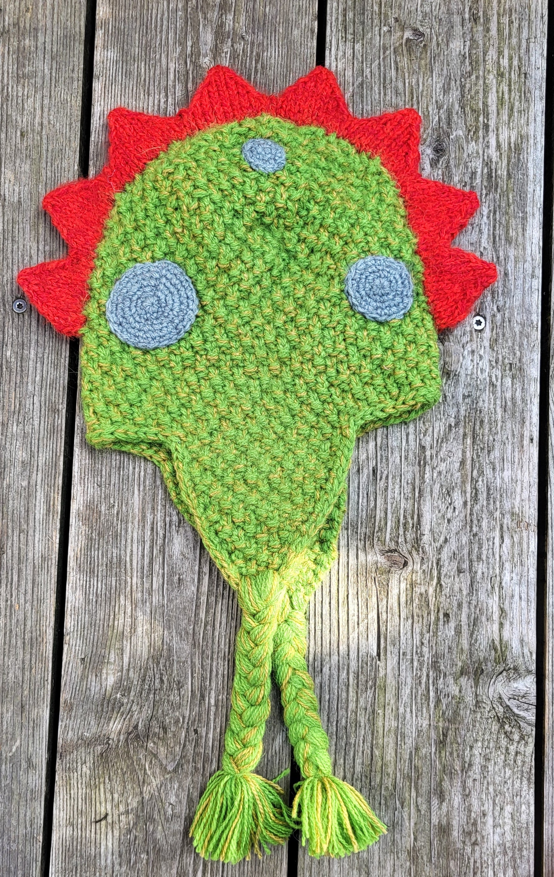 Wool dinosaur hat flat lay