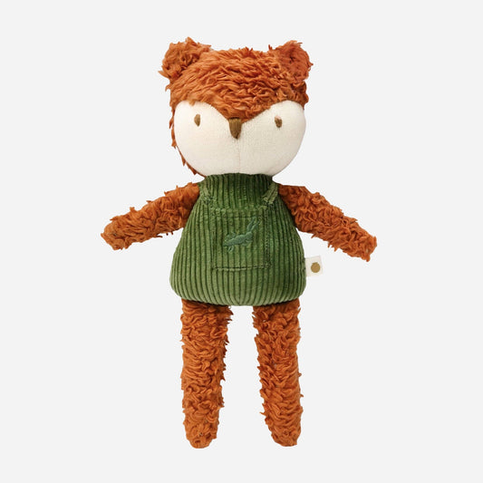 Plush toy fox wearing a green sweater on a white background