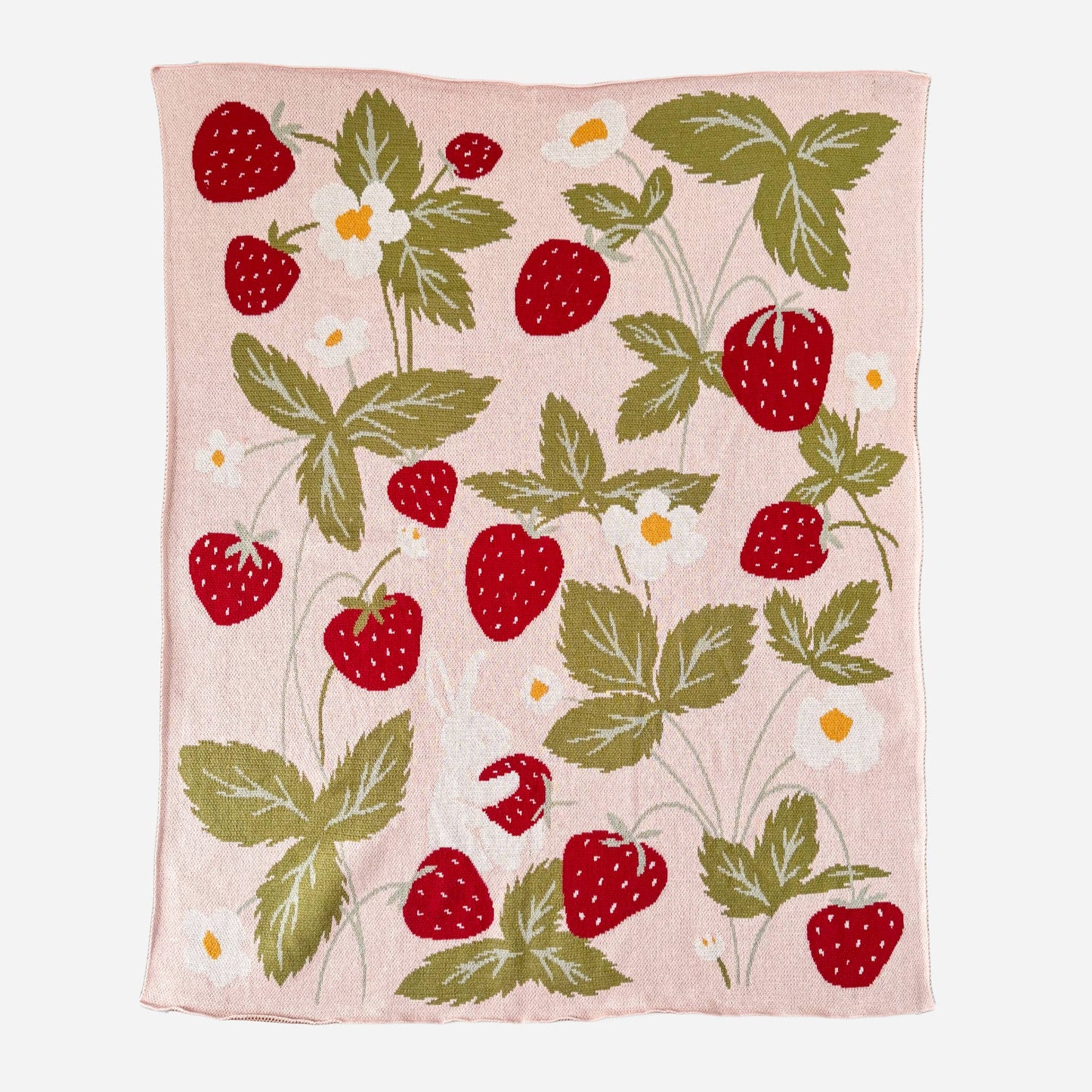 Blanket with strawberry pattern on a pink background
