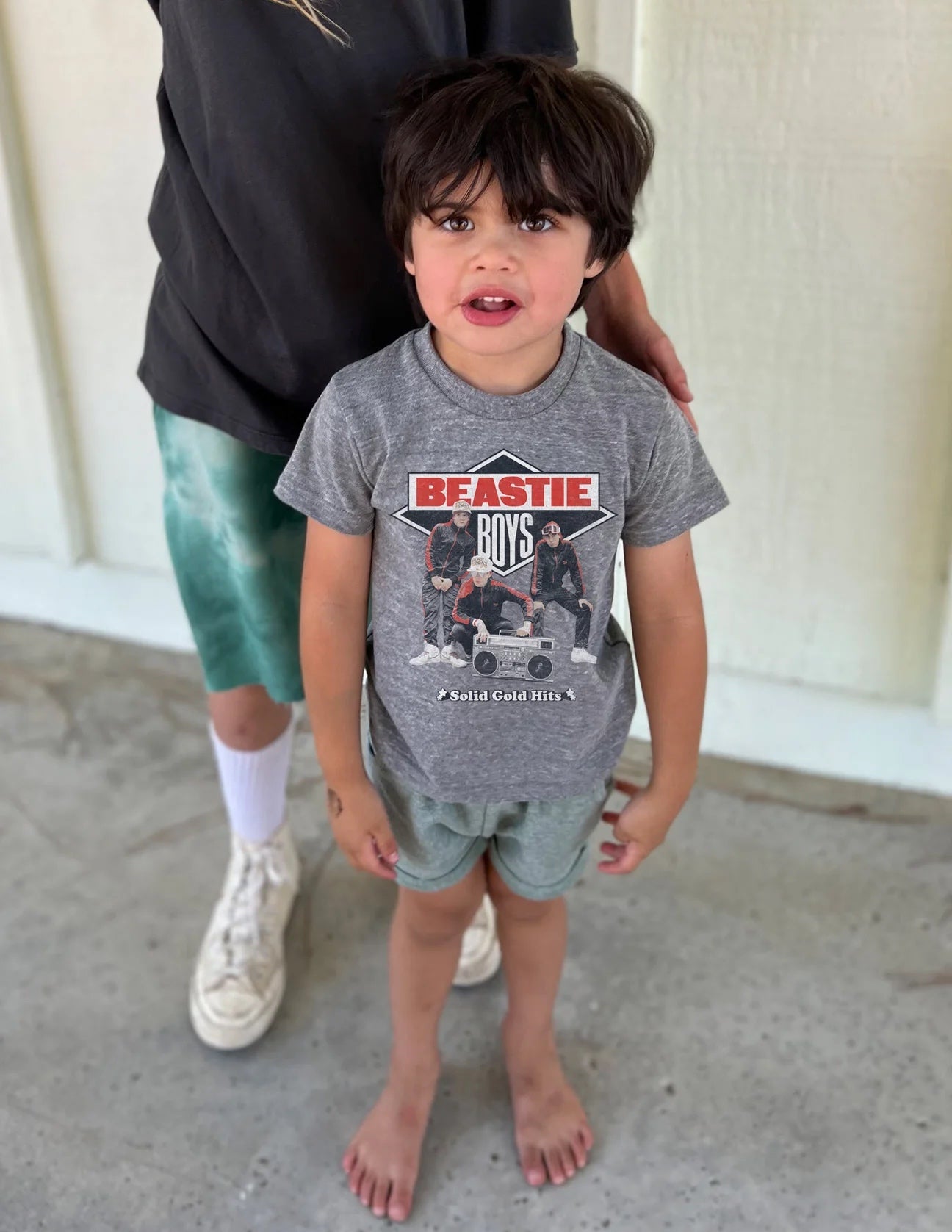 Child wearing a grey Beastie Boys short sleeve tee