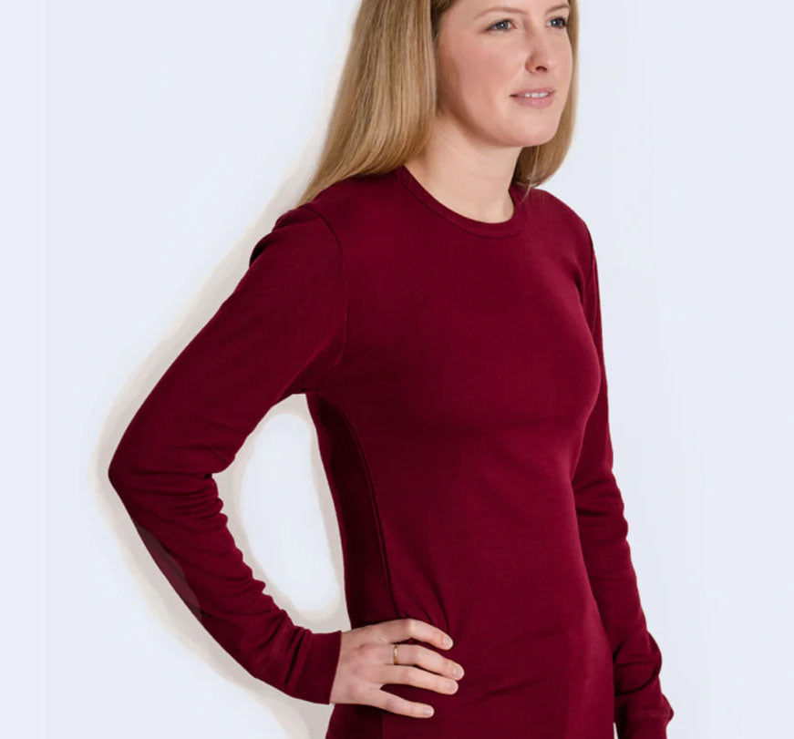 Women in a long sleeve bordeaux wool silk shirt