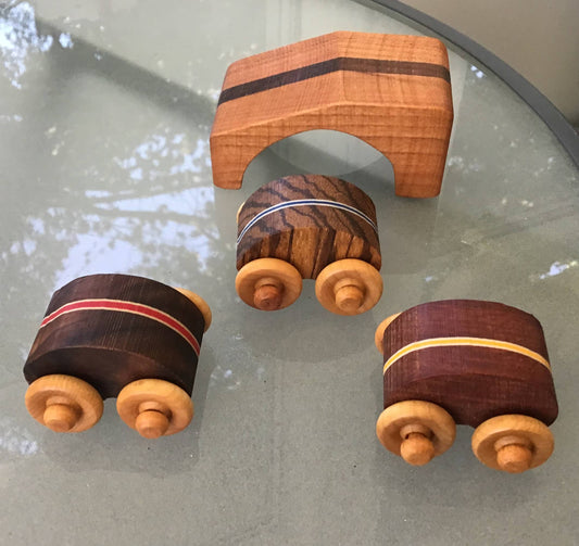 wooden flipsy car set with ramp on a glass table