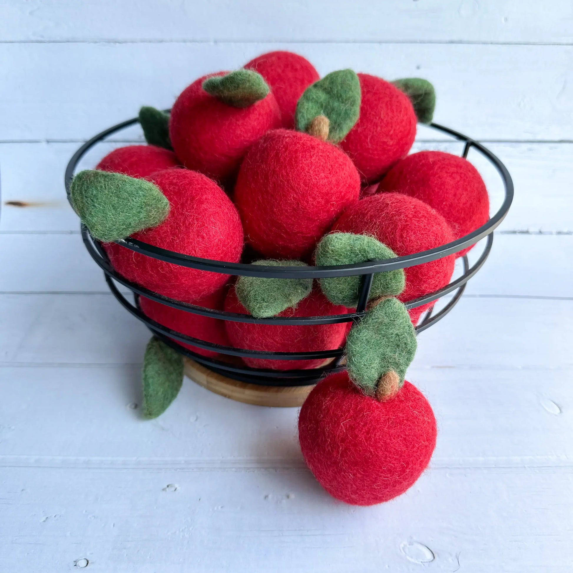 basket of large red felt apples