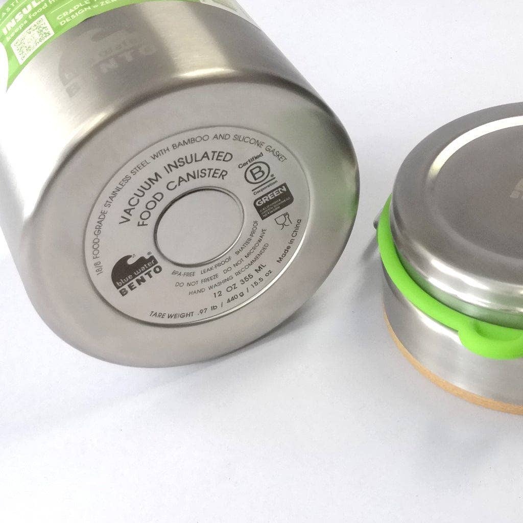 Bottom of acuum insulated food canister with bamboo lid on a white background