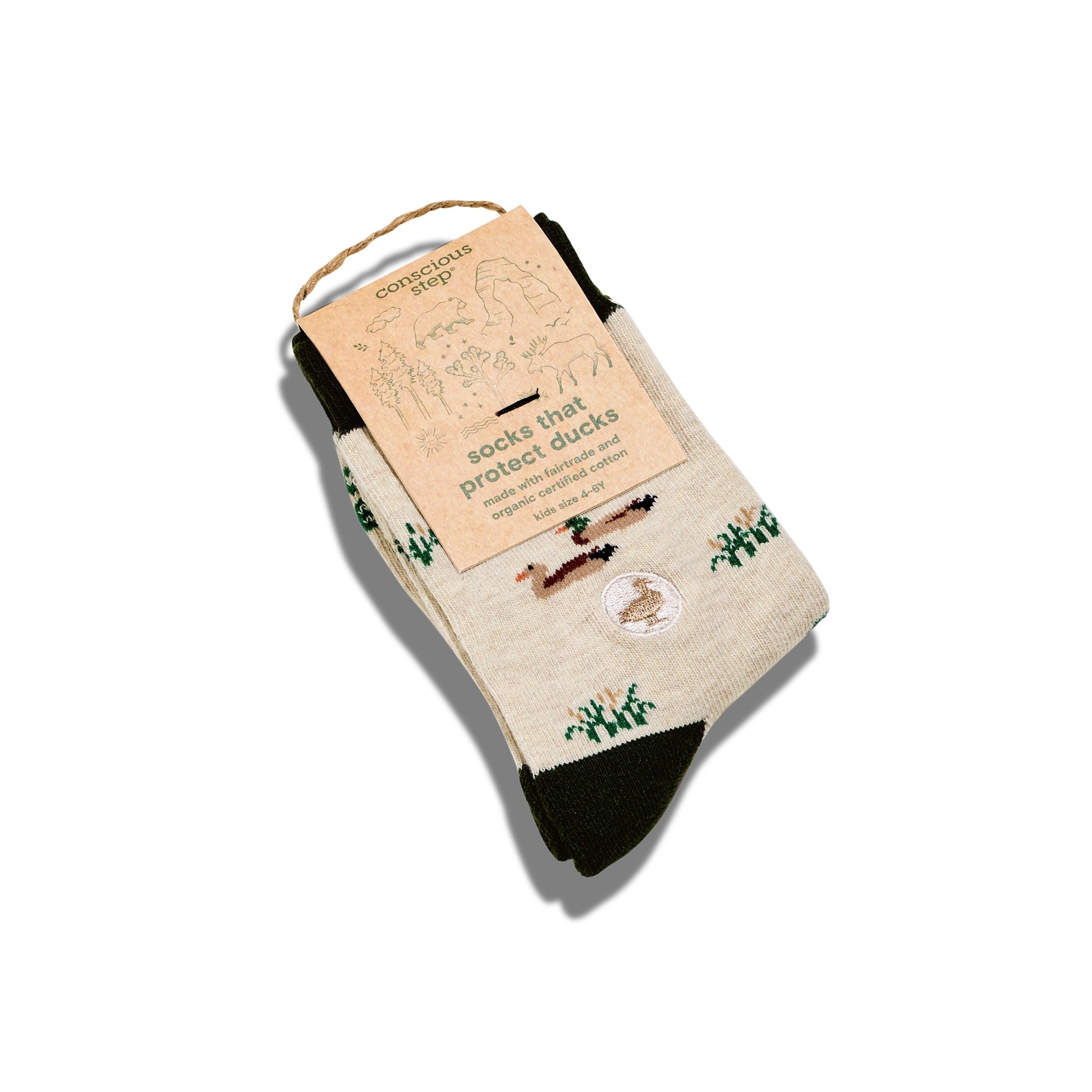 Beige socks with duck design and packaging on a white background