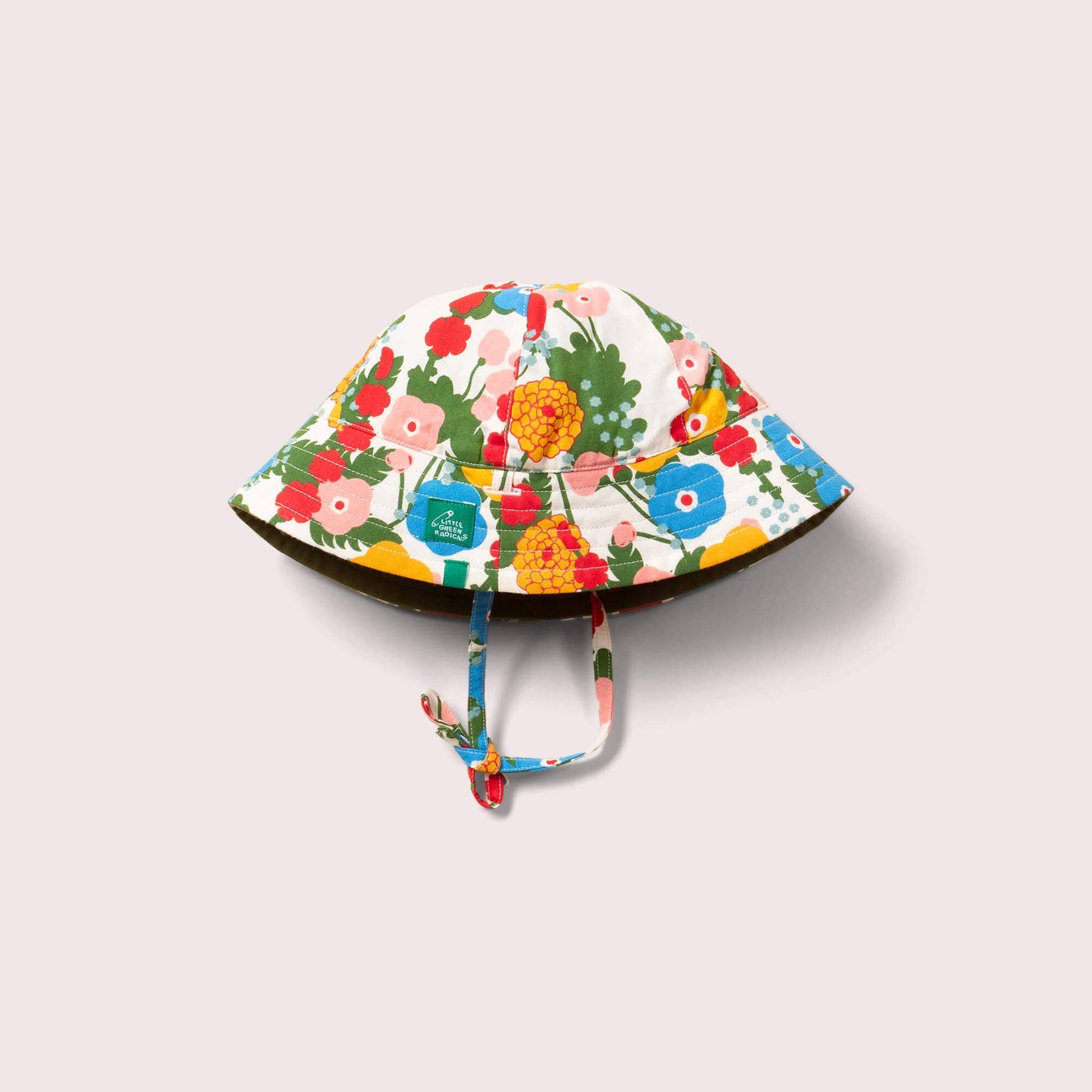 Floral patterned baby sun hat on a light gray background