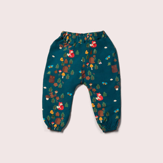 Enchanted forest parachute pants flat lay