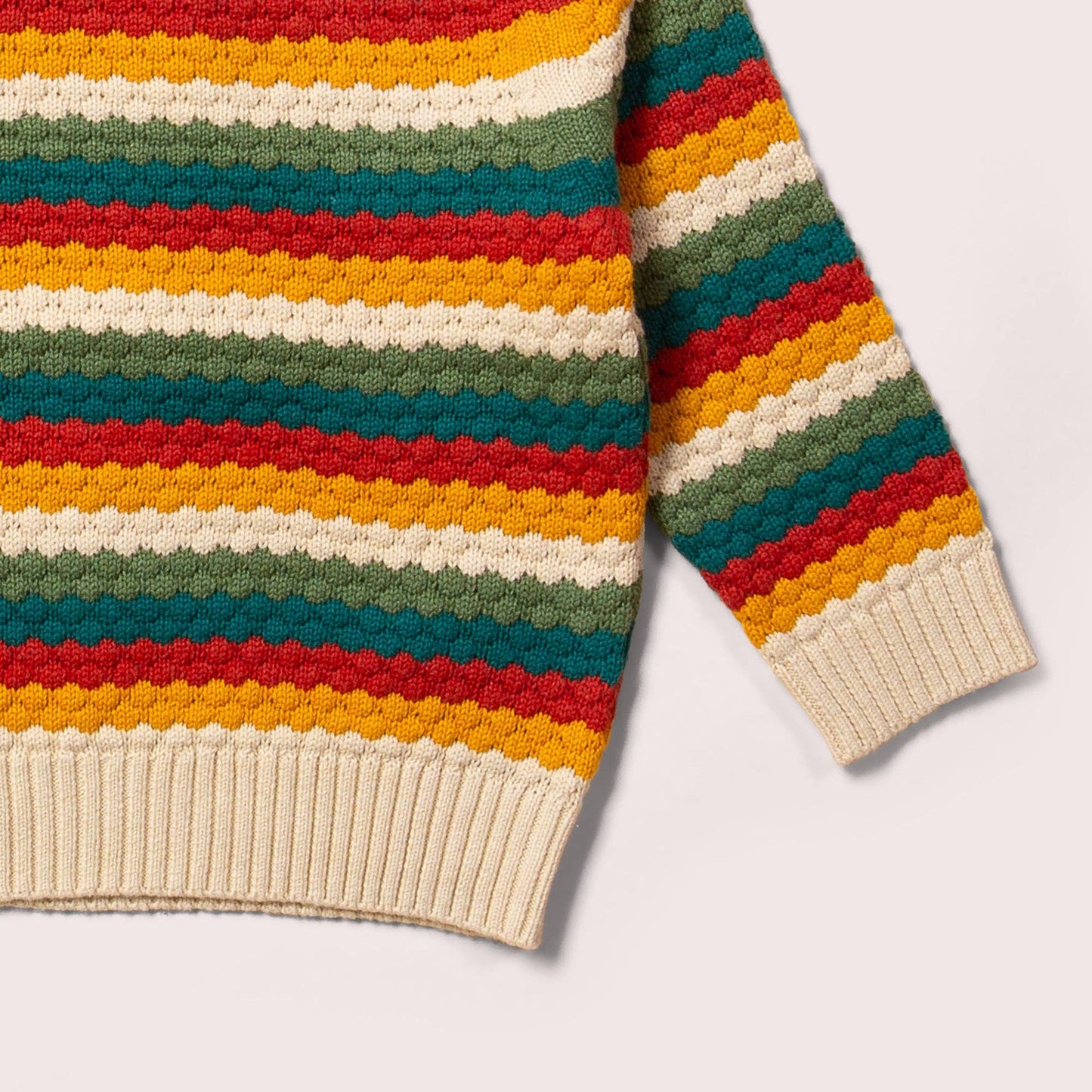 sleeve and bottom cuff detail for organic rainbow stripe knitted sweater