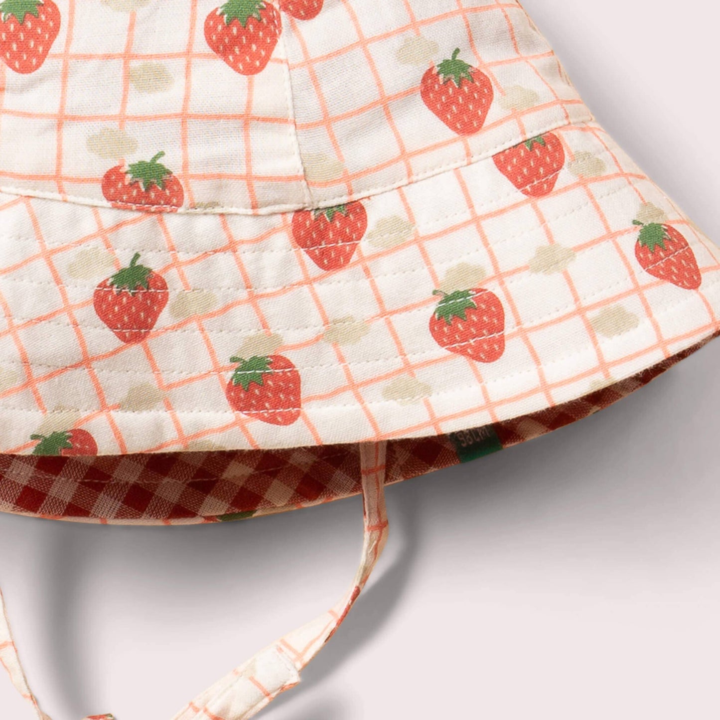 strawberry print detail on organic reversible strawberry hat