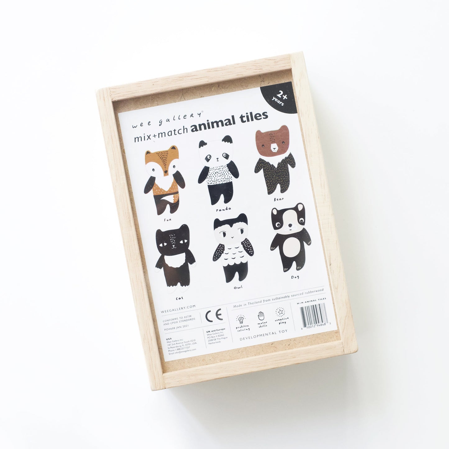 Box of mix-and-match animal tiles with illustrations on a white background