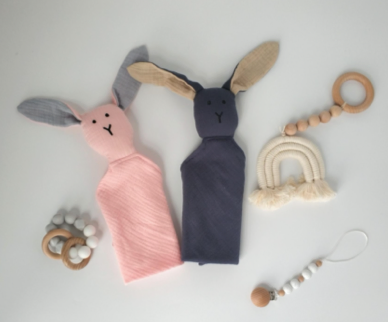 Bunny bo in pink and blue in a layout with other baby toys