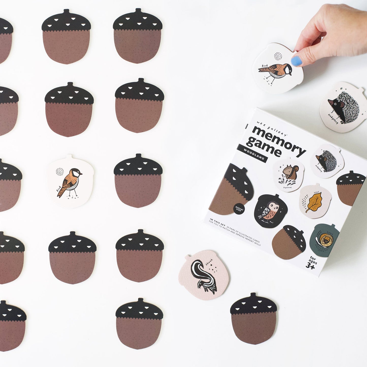 Memory game with acorn and animal-themed cards on a white background