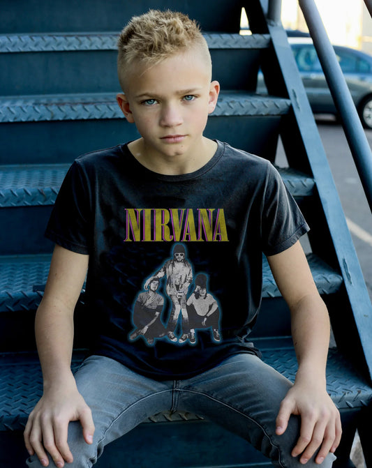 child sitting on metal stairs wearing Nirvana band tee in black