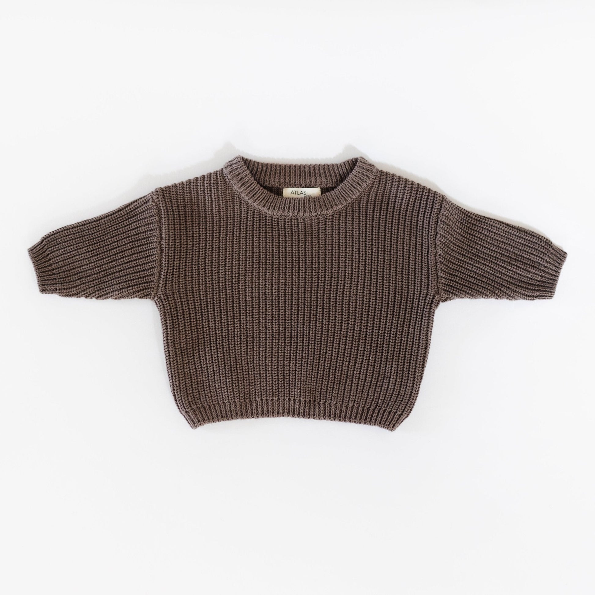 Brown knitted sweater on a white background