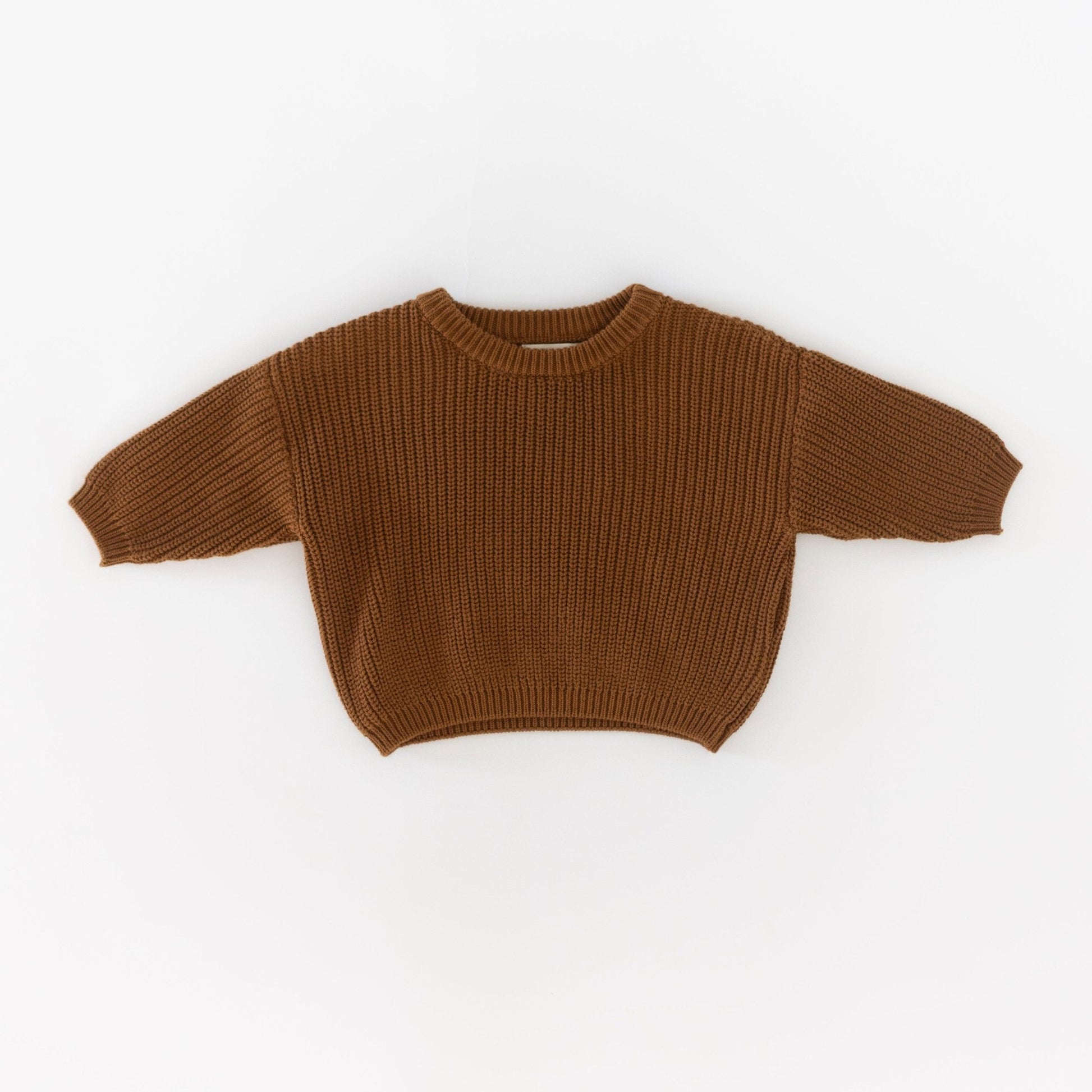 Brown knitted sweater on a white background