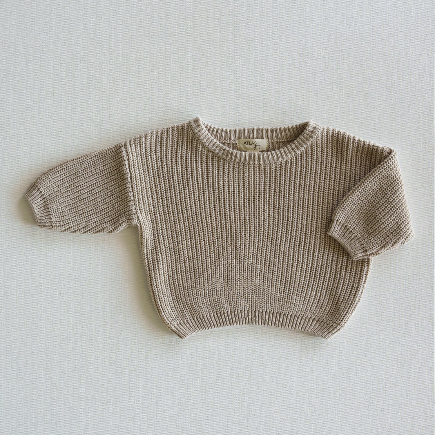 Knitted sweater on a light gray background