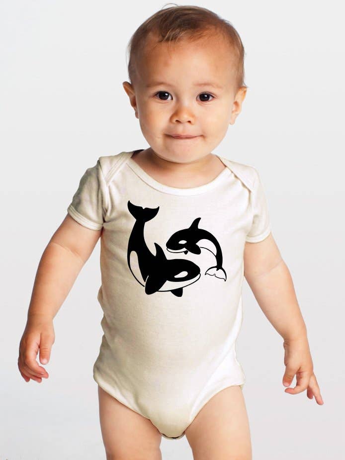 baby wearing Orcas Organic baby onesie