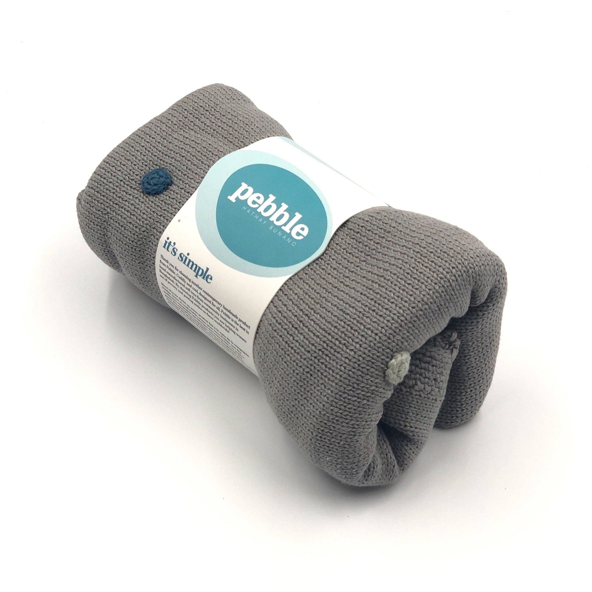 Gray knitted blanket with a Pebble label on a white background