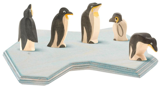 Penguin family on an ice tile
