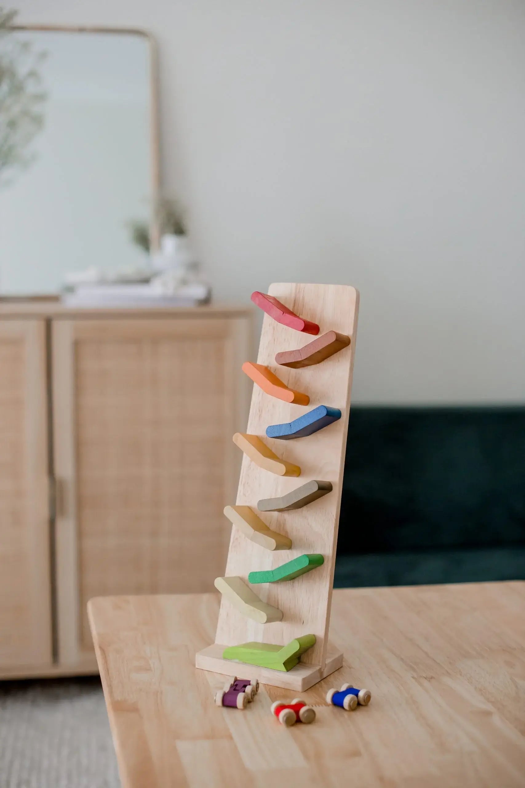 color zigzag racing cars on a wooden table