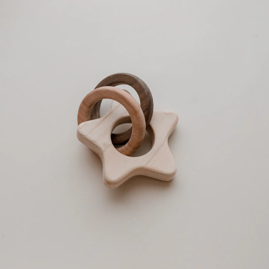 wooden star rattle with two wooden rings