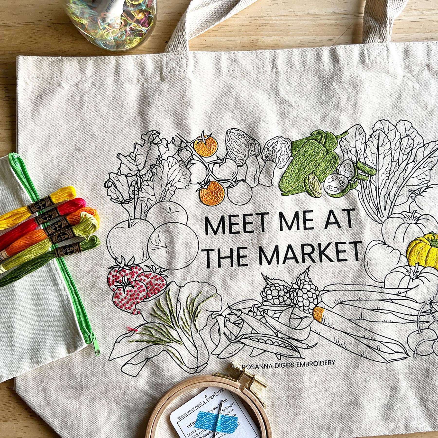 Totebag with embroidered vegetables and text 'Meet me at the market' and embroidery kit contents