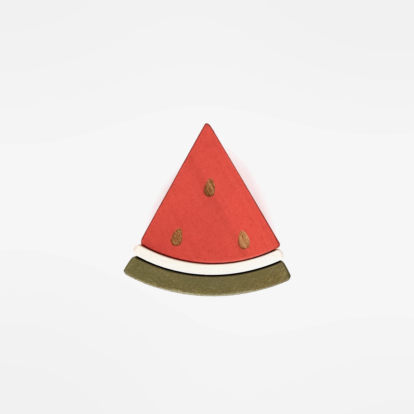 a wooden triangle piece of watermelon on a white back ground