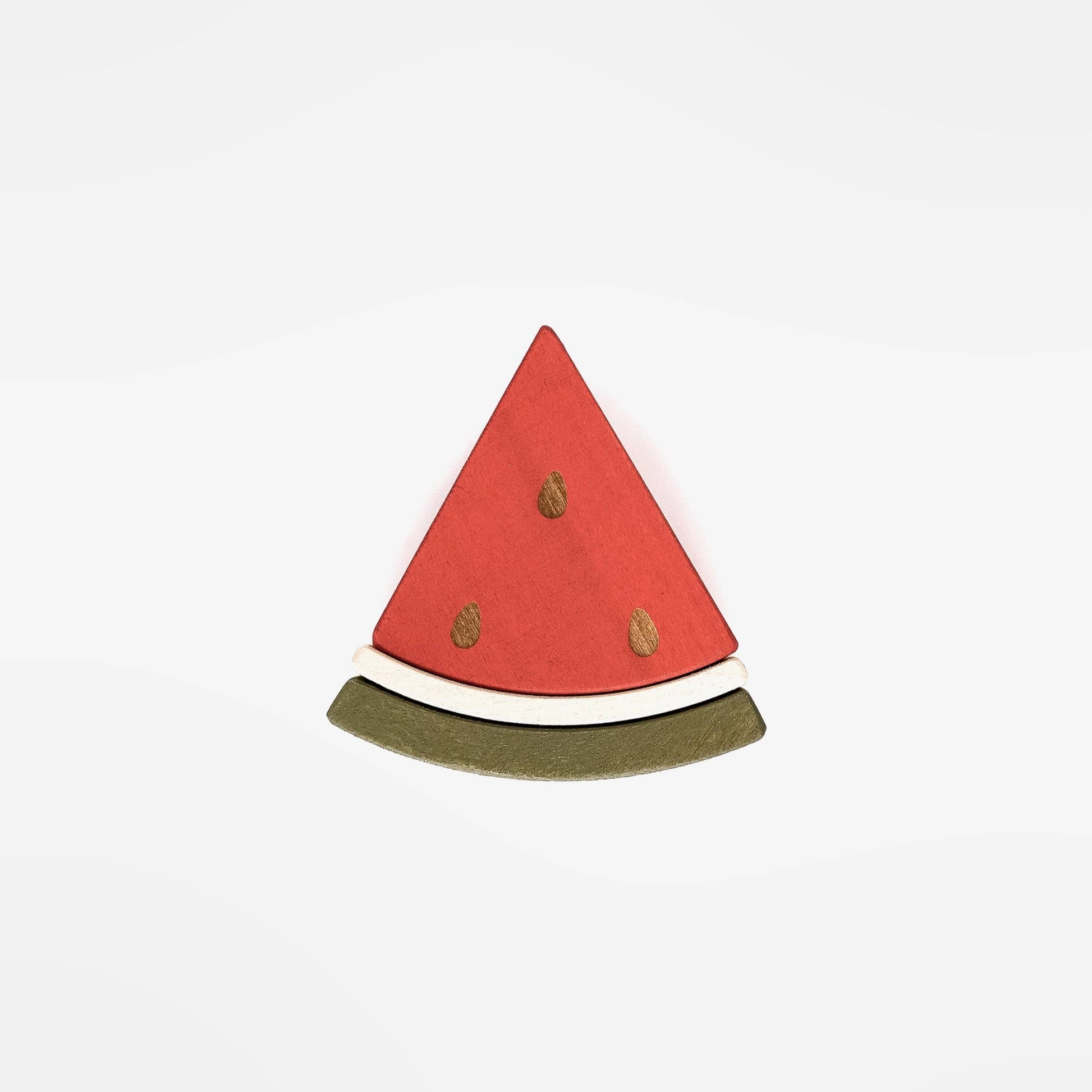 a wooden triangle piece of watermelon on a white back ground