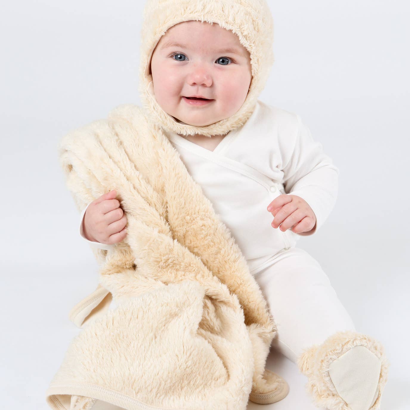 baby with sherpa hat and blanket