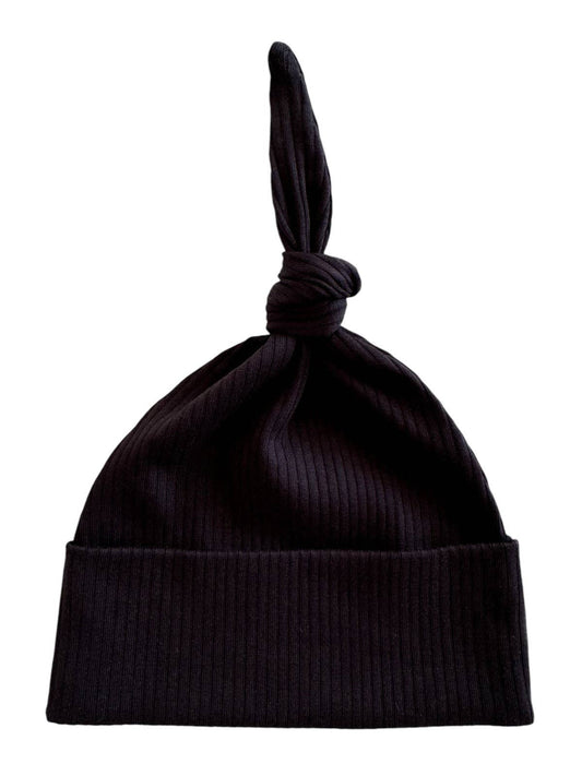 Black ribbed baby knot hat on a white background