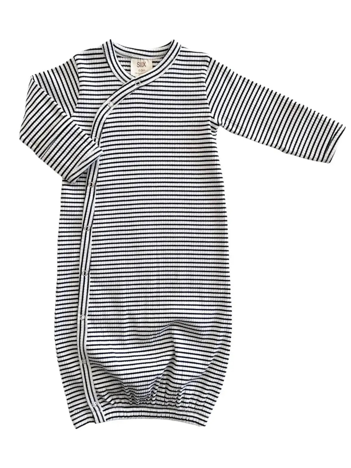 Black and white striped baby gown on a white background