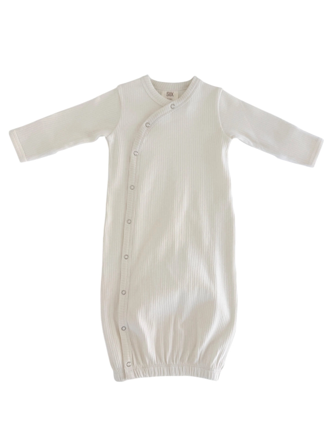 White ribbed baby gown on a white background