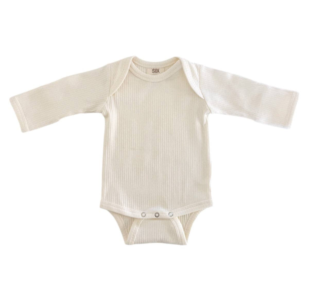 White baby onesie with long sleeves on a white background
