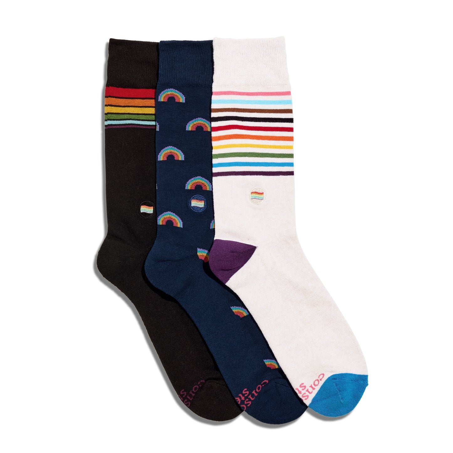 Three pairs of socks with colorful designs on a white background