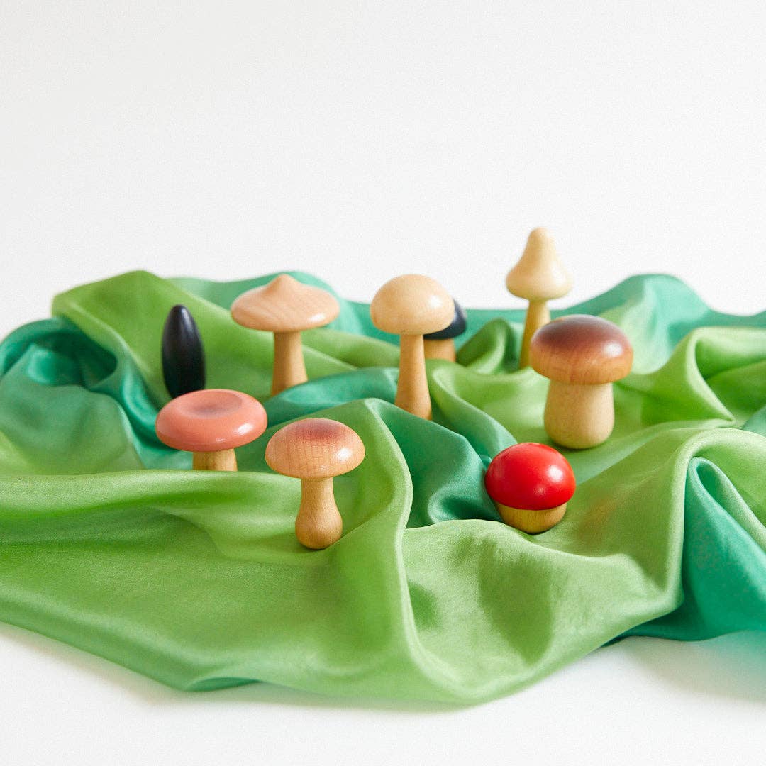 wooden mushroom set on a forest playsilk