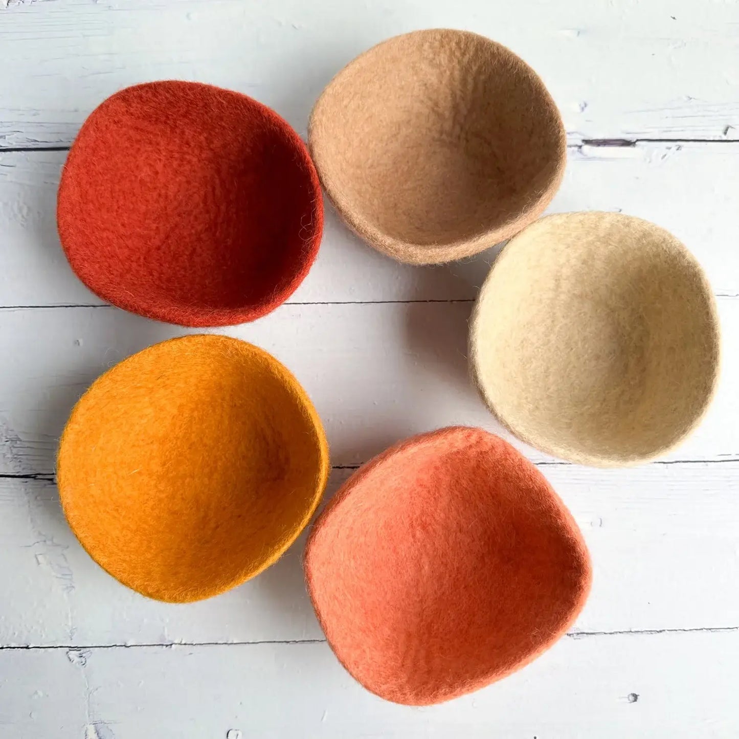 set of felt boho bowls in a circle on a table