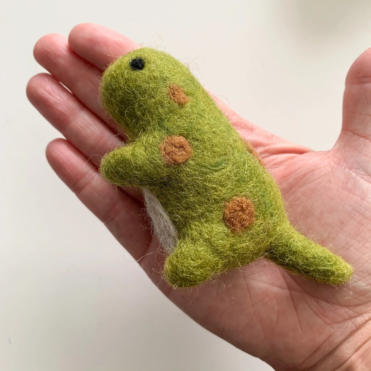 green baby felt dinosaur